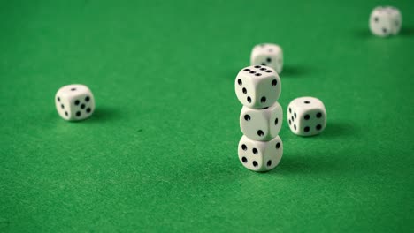Throwing-dices-of-a-green-game-table