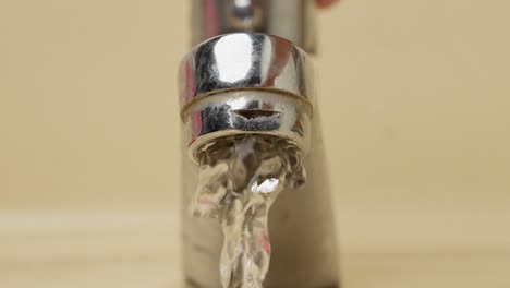 Water-spilling-from-an-open-faucet