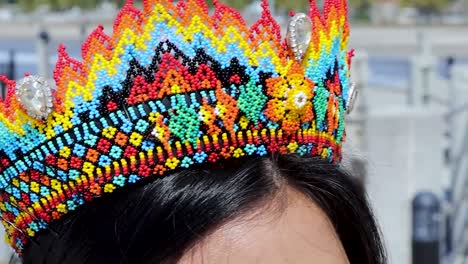 Woman's-head-wearing-beautiful-bead-crown-with-colorful-Huichol-art-pattern