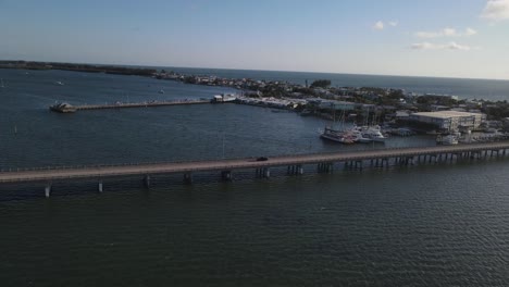 Aerial-view-of-bridge-by-marina-in-Florida