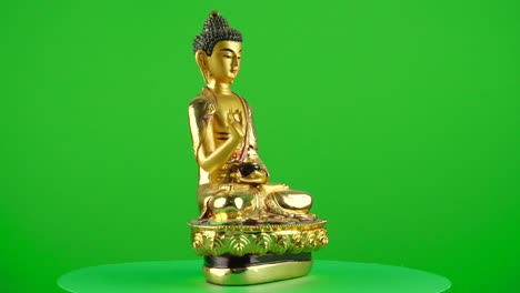 Thailand-golden-buddha-palm-figure-miniature-souvenir-memory-thai-birmania-on-green-background-chroma-key-background-replacement-backdrop-objet-in-a-turntable-3d-spinning-loop
