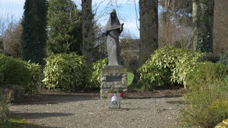 Wooden-Statue-Our-Lady-of-Trim---Maudlin-Cemetery-Yard-In-Trim,-Ireland