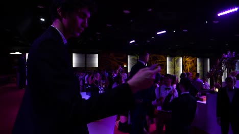 Slow-motion-shot-of-a-magician-doing-card-tricks-at-a-business-event