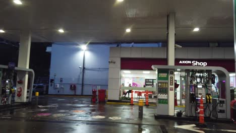 Inside-wet-gas-oil-station-store-convenience-cars-charging-castrol-axion-shop-at-buenos-aires-night