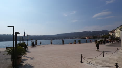 Salo',-Italy-march-5-2022-square-with-tables-and-lakeside-in-Salo,-Lake-Garda,-Brescia,-Italy