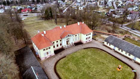 Aerial-view-of-Durbe-Manor-Neoclassical-manor-house-located-in-Tukums,-in-the-historical-region-of-Zemgale,-in-Latvia