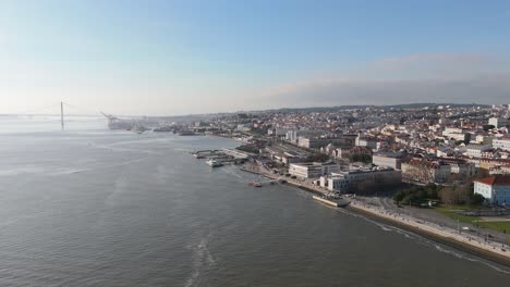 Panoramic-aerial-overview-of-Tagus-river-and-ferry-port-in-Lisbon-Portugal-on-Sunny-day