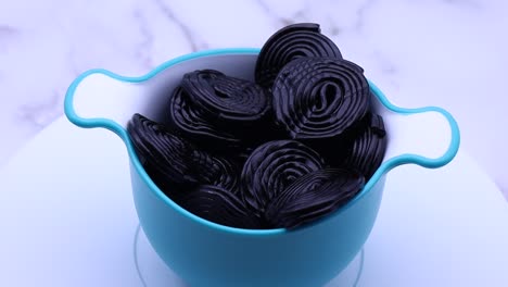Black-licorice-candies-on-white-background