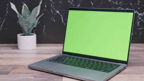 Green-screen-laptop-work-from-home-setup