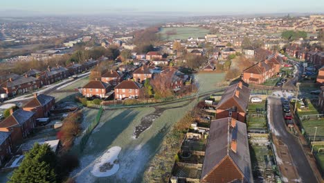 Drone's-eye-winter-view-captures-Dewsbury-Moore-Council-estate's-typical-UK-urban-council-owned-housing-development-with-red-brick-terraced-homes-and-the-industrial-Yorkshire