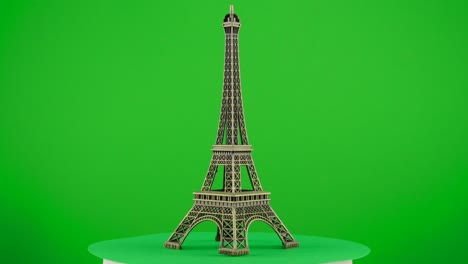 Figura-Modelo-De-Metal-De-La-Torre-Eiffel-De-París-Sobre-Fondo-Verde-Fondo-De-Croma-Clave-Reemplazo-De-Fondo-Objeto-En-Un-Tocadiscos-Bucle-Giratorio-3d