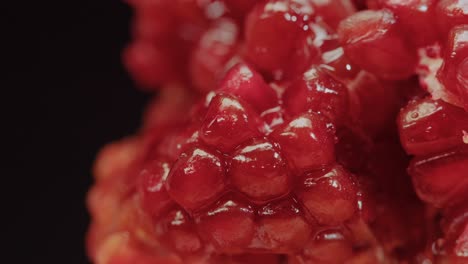 A-detailed-shot-capturing-liquid-sugar-pouring-over-the-inner-walls-of-a-pomegranate,-revealing-its-seeds