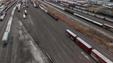 aerial-of-Canadian-National-Railway-St-Laurent-Montreal-Quebec-Canada-,-drone-fly-above-the-train-station-with-cargo-freight-Wagon