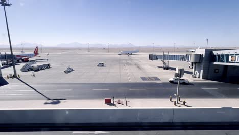 Airplanes-And-Airport-Vehicles-Seen-From-Departure-Lounge-Of-The-Boarding-Gate-At-Hurghada-International-Airport-In-Egypt