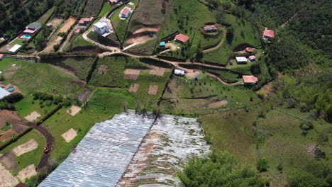 Aerial-View-of-Farming-Fields-With-Plastic-Covers,-Greenhouses-in-Landscape-of-Colombia,-Guatape-Region