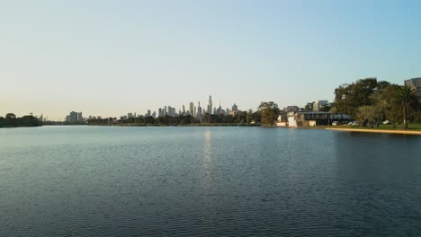 Low-level-view-of-a-lake-with-the-city-skyline-in-the-background