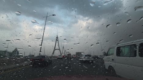 Heavy-rain-in-the-UAE:-A-view-from-the-car-dashcam-capturing-rainfall-in-Dubai,-United-Arab-Emirates