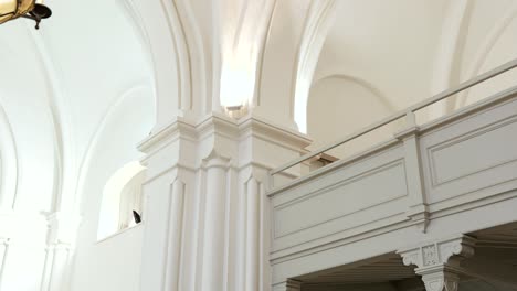 Architectural-detail-of-columns,-balcony-inside-Lutheran-church-in-Europe