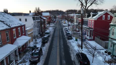 Rising-drone-shot-of-snowy-town-with-Colorful-houses-in-America