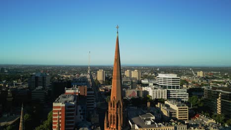 Aerial-drone-reveal-of-a-church-in-Melbourne,-Victoria,-Australia