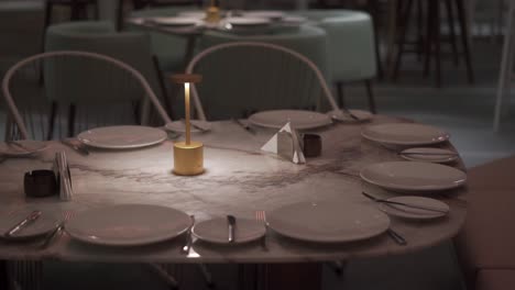 Front-view-of-stylish-and-light-dining-table-in-restaurant-close-up-shot