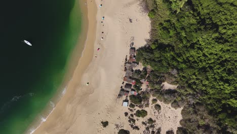 Drone's-perspective-unveils-splendor-of-Cacaluta-Bay,-gem-within-Bahias-de-Huatulco