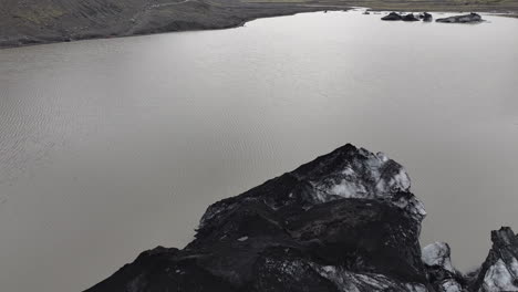 Aerial-View-Black-and-White-Glacier-Ice-and-Glacial-Lake-in-Landscape-of-Iceland