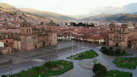 Exclusive-Aerial:-Plaza-de-Armas,-Cusco-Cathedral,-and-Compania-de-Jesus-Church-in-Cusco,-Peru