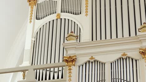 Slow-tracking-view-of-pipe-organ-at-front-of-old-Lutheran-temple