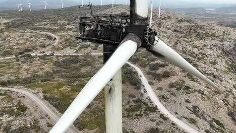 Extreme-aerial-spinning-shot-of-an-air-turbine-destroyed-by-a-fire-in-a-rural-arid-area-in-SE-Spain