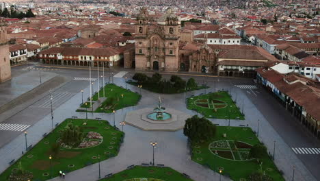 Exclusive-Aerial-View-of-Plaza-de-Armas-and-Society-of-Jesus-Church,-Cusco,-Peru