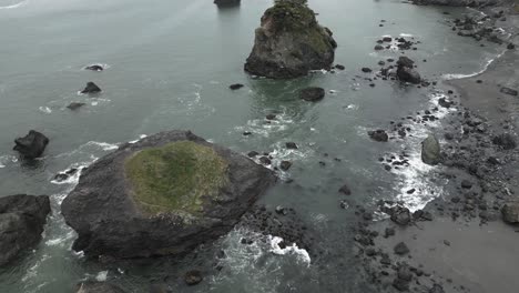 The-rugged,-rocky-coastline-of-the-Oregon-coast,-USA,-is-captured-in-revealing-footage,-showcasing-its-natural-allure-where-land-meets-sea