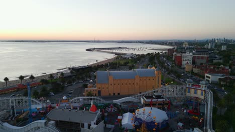 Aerial-drone-video-of-the-Luna-Park-in-Saint-Kilda,-Melbourne,-Australia