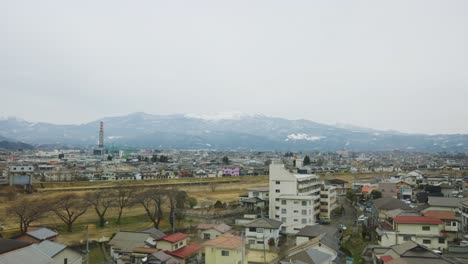 Neighbourhoods-of-Yamagata-in-Northern-Japan,-View-from-Train
