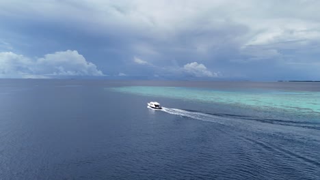 Drone-Shot-of-Speeding-Boat-in-the-Ocean-during-Cloudy-Day