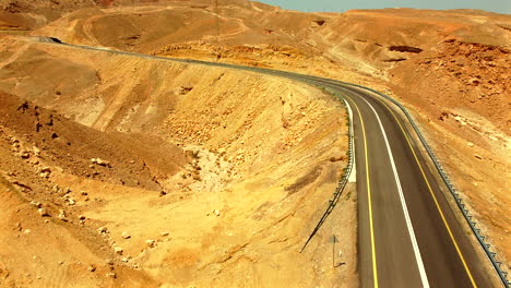yellow-dirt-from-each-side-when-highway-road-in-the-middle-drone-footage-cinematic-style