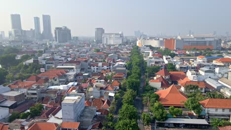 The-bustling-morning-soundscape-of-Surabaya-city,-with-industrial-areas,-dense-population,-office-buildings,-and-shopping-centers