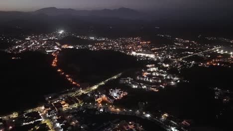 Nocturnal-aerial-vistas,-Huatulco's-heart,-La-Crucecita,-Oaxaca,-Mexico