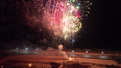 New-Year-fireworks-begin-shot-off-at-the-turn-of-midnight-on-the-beach-in-Ocean-City,-NJ