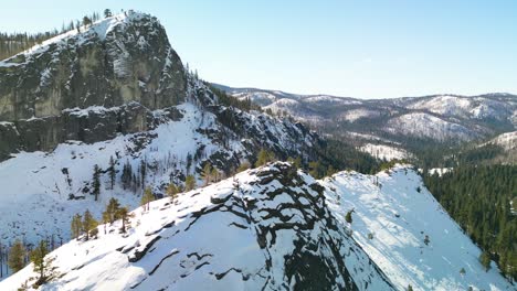 Aerial-view-of-wintery-rocky-mountains-and-valley,-Lake-Tahoe,-California