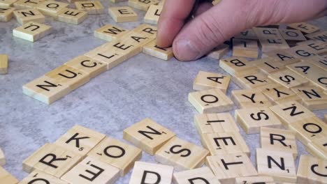 Scrabble-letter-tiles-added-to-word-NUCLEAR-creates-crossword-with-WAR