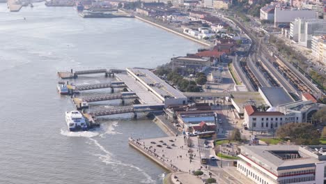 Aerial-high-angle-overview-of-ferry-port-dock-on-Tagus-River-in-early-morning,-Lisbon-Portugal