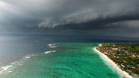 
Color-contrast-between-stormy-black-clouds-over-turquoise-ocean-water-of-Nusa-Lembongan-in-Indonesia