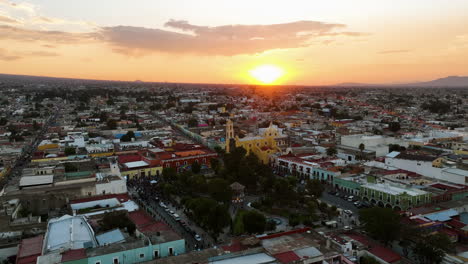 Drone-flying-around-the-San-Luis-Obispo-Baroque,-sunset-in-Huamantla,-Tlaxcala-Mexico