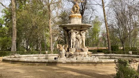 We-see-in-the-Jardin-de-el-Principe-an-impressive-fountain-with-human-sculptures-holding-a-main-character-Narcissus-on-a-round-pedestal-from-there,-the-Fountain-of-Narcissus-from-the-18th-century