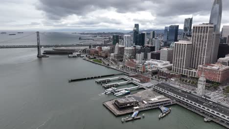 Aerial-footage-of-downtown-San-Francisco-along-with-the-Bay-Bridge,-and-Ferry-building