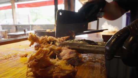 SLOW-MOTION-SHOT-OF-CARNITAS-ON-A-RESTAURANT-IN-URUAPAN