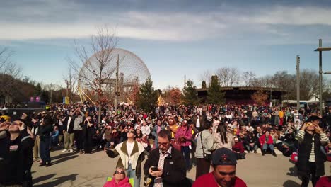 Crowd-watching-the-total-solar-eclipse-of-April-8,-2024-at-Parc-Jean-Drapeau-in-Montreal,-Canada