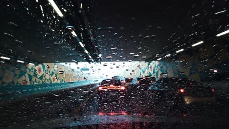 Heavy-rain-in-the-UAE:-A-view-from-the-car-dashcam-capturing-rainfall-in-Dubai,-United-Arab-Emirates