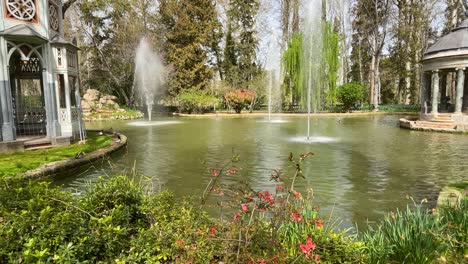 filming-of-the-Chinese-pond-where-on-one-side-is-the-blue-marble-temple-and-on-the-other-the-wooden-bird-house,-leaving-in-the-center-the-jets-of-water-in-the-Garden-of-the-Prince